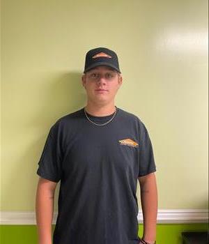 Young man standing in Servpro shirt