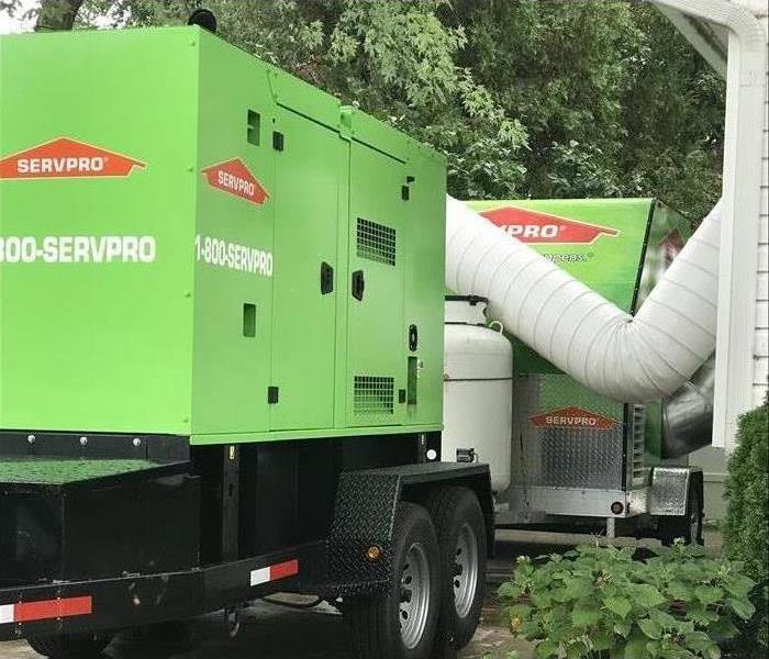 A desiccant and a generator outside this home 